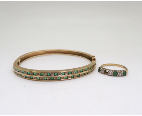 A 9ct gold emerald and diamond bangle, together with a similar cz and emerald ring size N, weight together 14.5gms Condition 