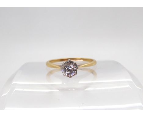 A diamond solitaire ring, set with an estimated approx 0.70cts old cut diamond in a platinum crown mount with an 18ct gold sh