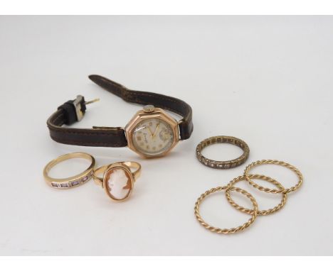 Two 9ct gold rings one set with diamond accents and amethysts, size Q1/2, and a full clear gem eternity ring size N1/2, three