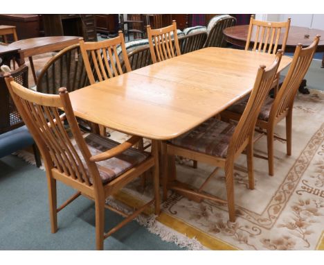 A contemporary Ercol elm and beech dining suite comprising extending dining table, 74cm high x 151cm long (201cm extended) x 