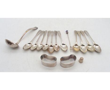 A collection of silver including a matched set of seven silver oar pattern tea spoons, various makers, monogrammed terminals,