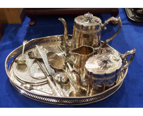 A collection of EPNS including an oval serving tray, with openwork gallery, a four piece EPNS tea service, napkin rings, plac