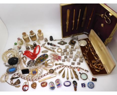 Vintage perfume bottles, a gold plated manicure set, and a quantity of costume jewellery to include enamel badges, buttons, i