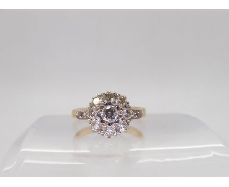 A bright yellow and white metal diamond cluster ring, set with estimated approx 0.55cts of brilliant cut diamonds, finger siz