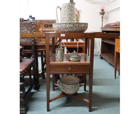 A 19th century mahogany wash stand with twin hinged top over single drawer on square tapering supports joined by crossed lowe