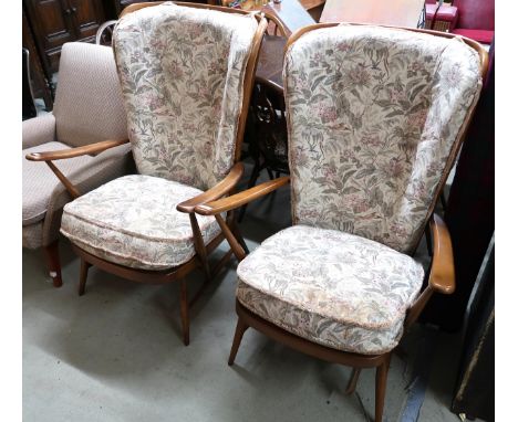 A pair of mid 20th century Ercol elm and beech open armchairs with floral foliate upholstery, 104cm high x 74cm wide x 73cm d