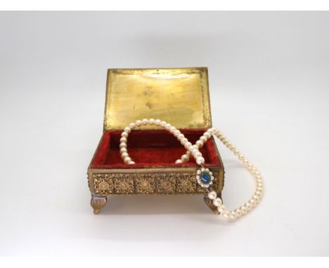 A string of pearls with a 9ct gold opal doublet and pearl set clasp, length 43.5cm, pearls all approx 6.3mm, weight 25.8gms C