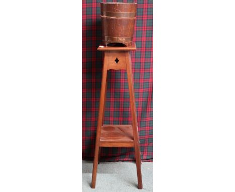 An early 20th century mahogany two tier jardinière stand, 92cm high and a small coopered planter (2) Condition Report:Availab