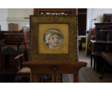 William Frederick Yeames, a circular oil portrait of a lady wearing a bonnet. 7ins diameter. In a gilt slip and gilt frame wi