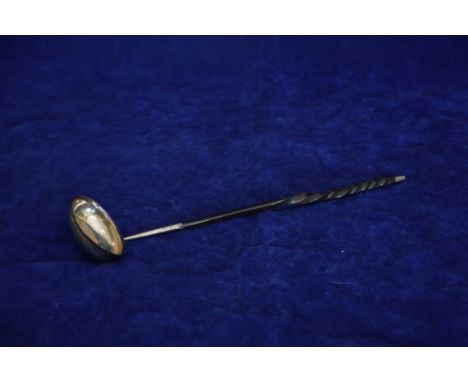 A George III silver toddy ladle with twisted baleen handle and silver cap. London 1808. Makers mark partially rubbed. Est £25