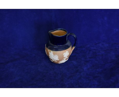 A Royal Doulton jug decorated with a hunting scene and with figures drinking and smoking. 6ins high. Est £15-30