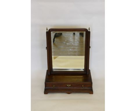 A George III mahogany dressing table mirror with brass finials above tapering supports to the bevelled mirror plate. The box 