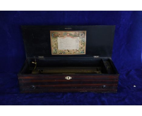 A 19th century Swiss music box, the lid with marquetry inlay depicting musical instruments surrounded by scrolls and stylised