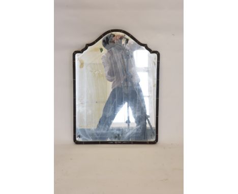 A tortoiseshell and bone inlaid wall mirror with shaped arched top (af). 19ins wide. Est £50-70