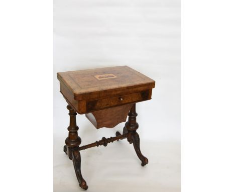 A Victorian walnut and Tunbridge ware inlaid games table, the top with Tunbridge ware depiction of Eridge castle surrounded b