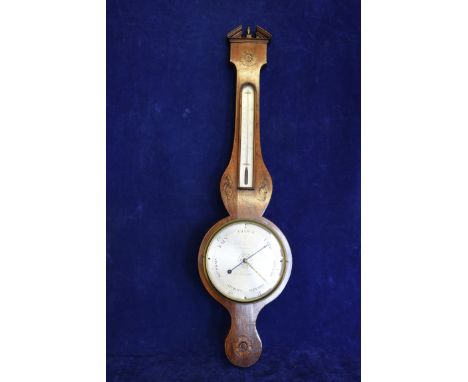 A 19th century mahogany barometer thermometer with broken arched pediment with central brass urn form finial above a stylised