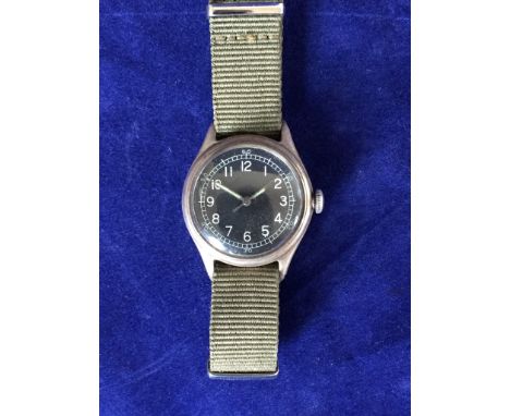 A Bulova watch co military issue wristwatch type A-II circa 1940’s. The black dial with Arabic numerals and luminous hands, t