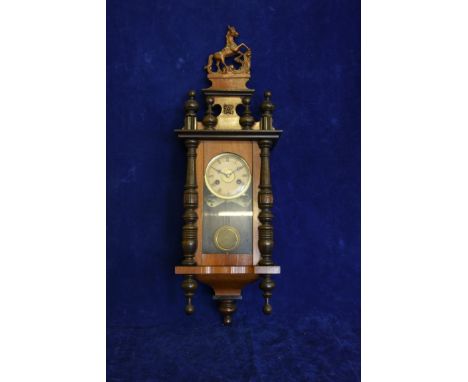 A Vienna Regulator clock with finial in the form of a horse.  Est £30-50