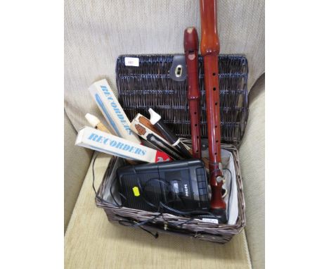 FIVE RECORDERS , TWO OTHER WOODEN INSTRUMENTS TOGETHER WITH A PHILIPS CASSETTE RECORDER AND SMALL WICKER BASKET.