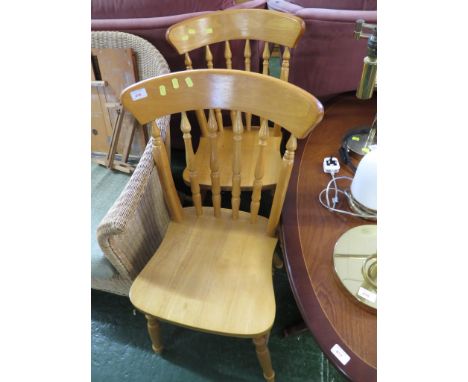 TWO LIGHT WOOD DINING CHAIRS.