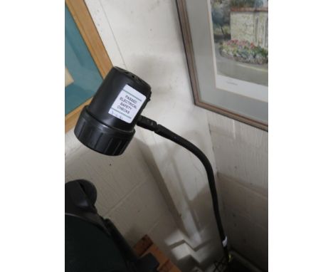 FLOOR STANDING DIRECTIONAL LAMP.