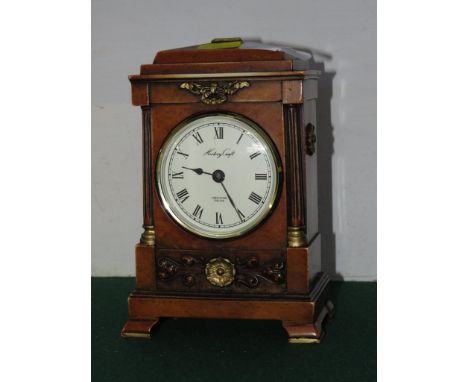  A REPRODUCTION MANTEL CLOCK.