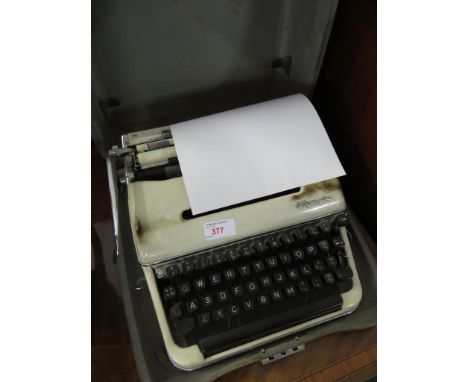 VINTAGE OLYMPIA MANUAL TYPEWRITER IN CASE.