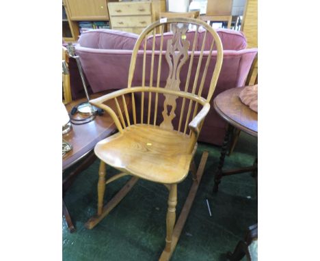 LIGHT ELM WINDSOR STYLE ROCKING CHAIR.