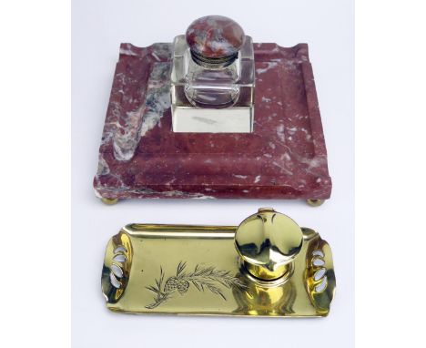 An Art Nouveau period brass ink well 18cm long, together with a marble and clear glass inkwell 19.5cm wide. (2). 