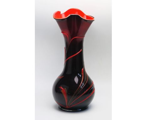 A Murano style art glass vase, of waisted form with flared lobed rim, with whiplash decoration, 44cm high. 