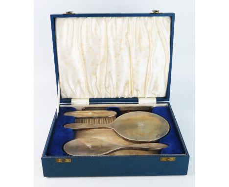 An Elizabeth II silver mounted dressing table set, maker Barker Ellis Silver Co, Birmingham, 1965, initialled, includes hair 