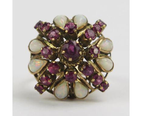 A 14K Gold, Opal and Red Stone Cluster Ring, 22mm head, size L.5, stamped 14K (on Presidium II tests as rubies), 4.91g 