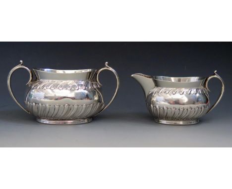 A Victorian two-piece part tea service, maker Goldsmiths &amp; Silversmiths Co, Sheffield, 1891, includes cream jug and sucri