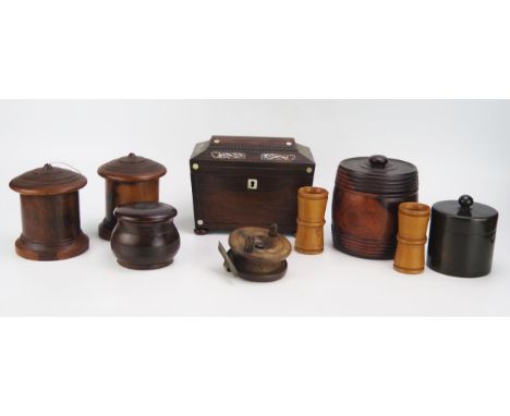 A 19th century rosewood and mother-of-pearl inlaid tea caddy of sarcophagus outline, raised on squat bun feet, 20cm wide, a h