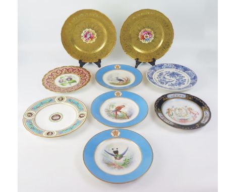 A set of three 19th century porcelain ornithological plates, enclosed by a powder blue border with gilt monogram, together wi