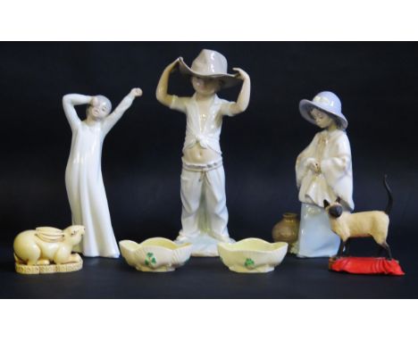 Two Nao porcelain figurines another similar figure, two small Belleek porcelain basket salts, a resin model of a hare and ano