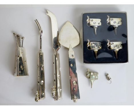 A plated cheese companion set, includes cheese knife, fork, slice, olive forks and vase together with five cheese name holder