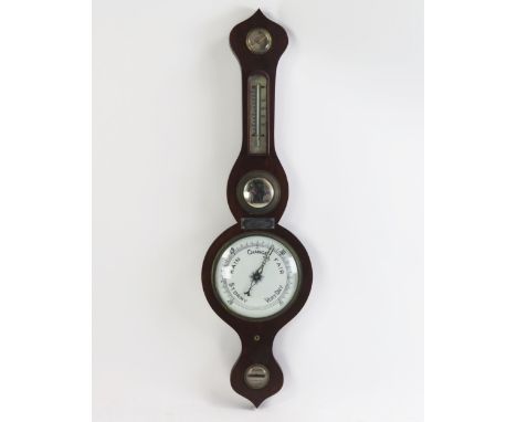 A Victorian mahogany onion topped wheel barometer, fitted with hygrometer, mercurial thermometer, concave mirror, 20cm dial w