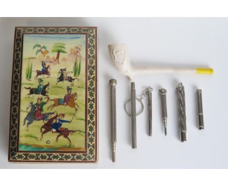 Three propelling pencils, two lead holders, a clay pipe with Irish harp decoration, and a Sadeli ware box. 