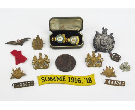 A small collection of army badges, Army rifle medallion, RAF enamel lapel badges etc. 