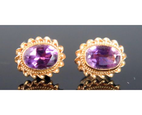 A Pair of 9ct Gold and Amethyst Stud Earrings, c. 10.5x9mm, hallmarked, 1.61g 