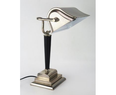 An Art Deco Style polished chrome and leatherette banker's lamp, with swivel shade on a tapering column and stepped rectangul