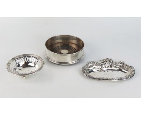 A Sterling silver pin tray in the Art Nouveau style, of oval outline with embossed female decoration, 15cm wide, a circular s