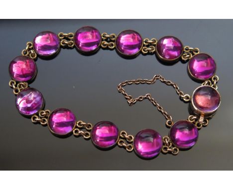 A Cabochon Amethyst Bracelet in a precious yellow metal mount, KEE tests as 9ct, 7" (18cm), early 20th century, 16.74gUNLESS 