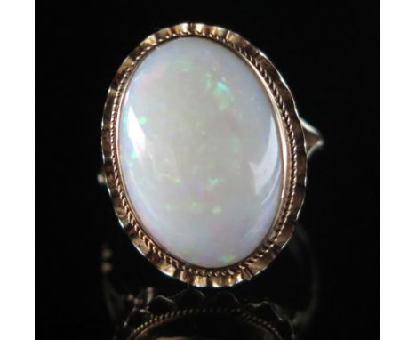 A 9ct Gold and Opal Dress Ring, 17.6x12.1mm singlet specimen, size L, hallmarked, 4g 