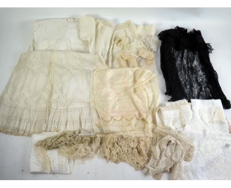 A collection of lace and crochet collars, cut work table cloths, Victorian black lace shawl, lace edged blouse and other item