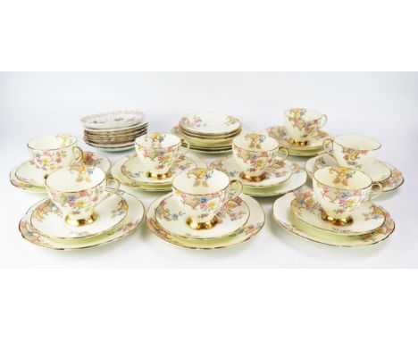 A Foley bone china part tea service with floral decoration heightened in gilt, includes eight cups and saucers, sideplates. (