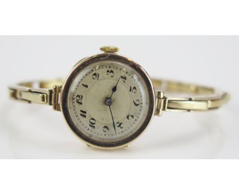 A 9ct Gold Ladies Wristwatch with a Swiss manual wind movement and on a 9ct gold spring loaded bracelet, 23.7mm case, 17.79g 