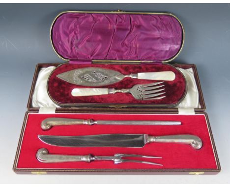 A silver handled three-piece carving set, the knife, fork and steel with pistil grip handles, cased, together with a mother-o