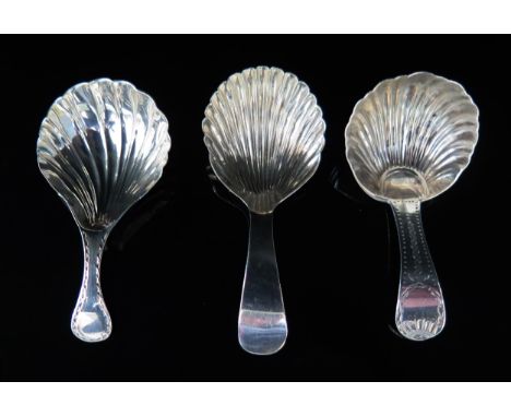 A George III silver Old English pattern caddy spoon, makers mark worn, London, 1800, with shell-shaped bowl, a similar caddy 